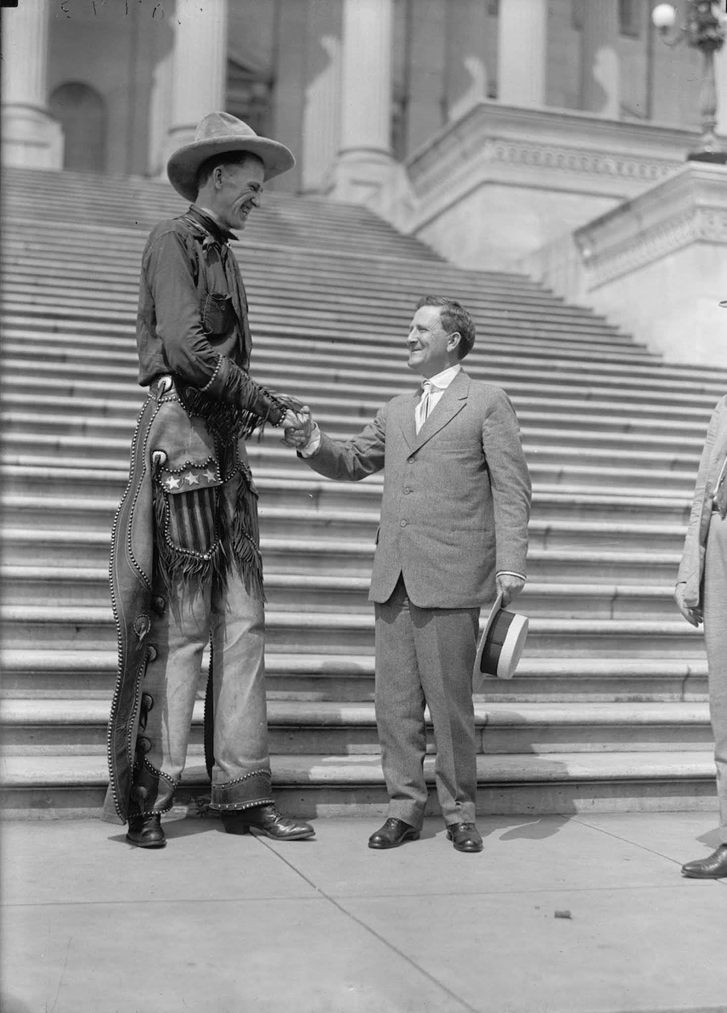 Madsen shaking hands with Senator Morris Sheppard at the capitol. 1919.