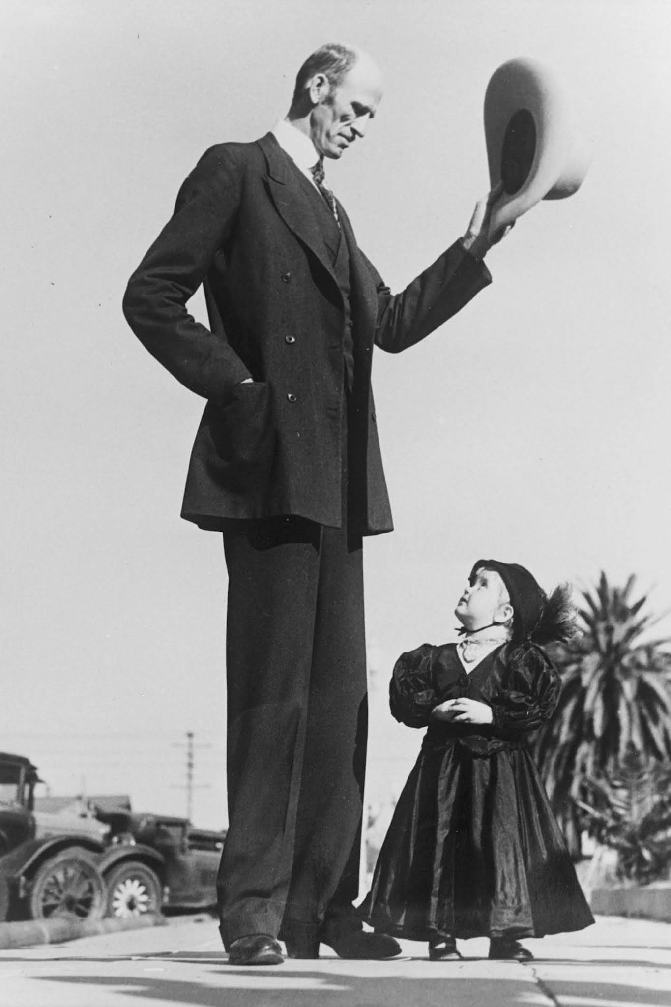 Madsen raises his hat on greeting Barbara Carlson, in Santa Monica, California. 1932.