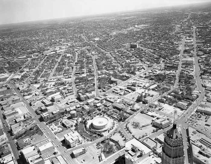 Aerial view looking east, southeast toward future site of HemisFair, 1964