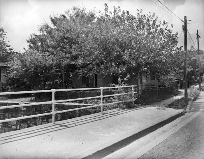 Front of small brick and tile house, 417 Camaron Street, San Antonio, 1968