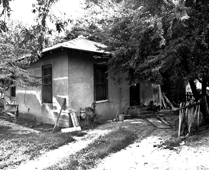 Back of small brick and tile house, 417 Camaron Street, San Antonio, 1968