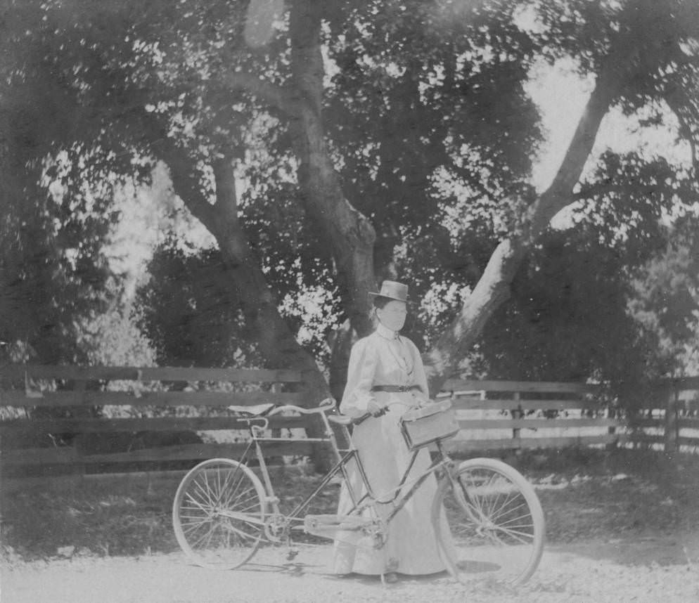 Woman with tandem bicycle, 1897.