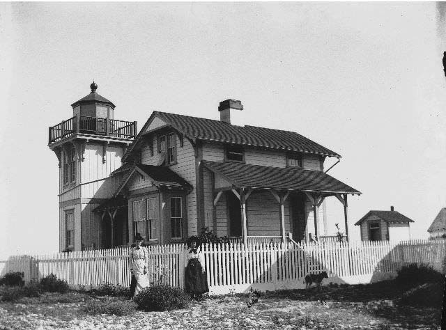 Two women standing at the Ballast Point Lighthouse, 1899