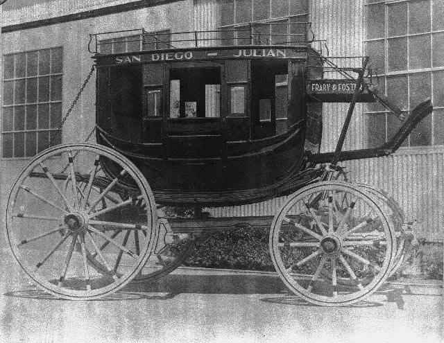 San Diego-Julian stagecoach on display outside a building, 1895