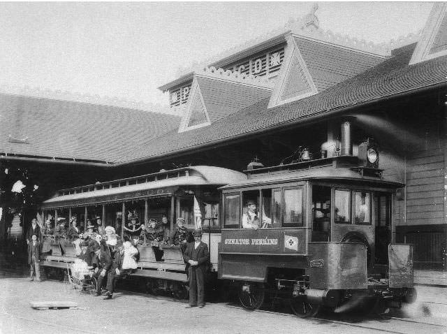 People aboard the Pacific Coast Steamship Company's train at the company's station, 1895