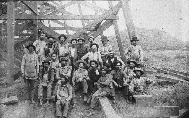 Flume construction workers under the Los Coches trestle, 1893