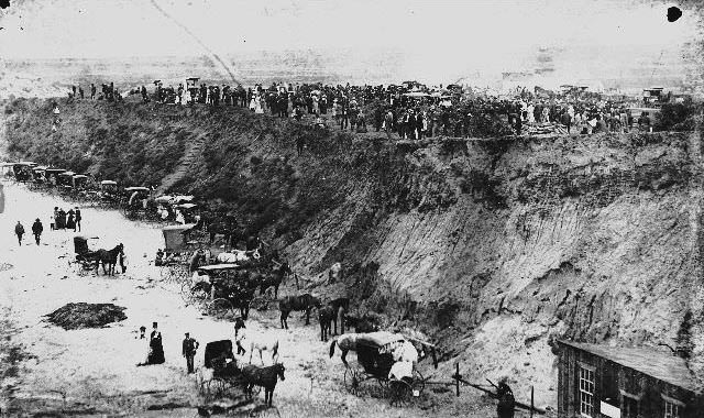 People standing on and below bluffs in Ocean Beach, 1892