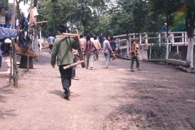 Commune carrying benches to meeting, Shanghai, 1970s