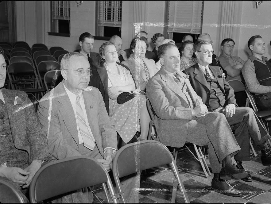 First Selectman (for 1942) James Simone (left) attending the town meeting in his capacity as citizen.