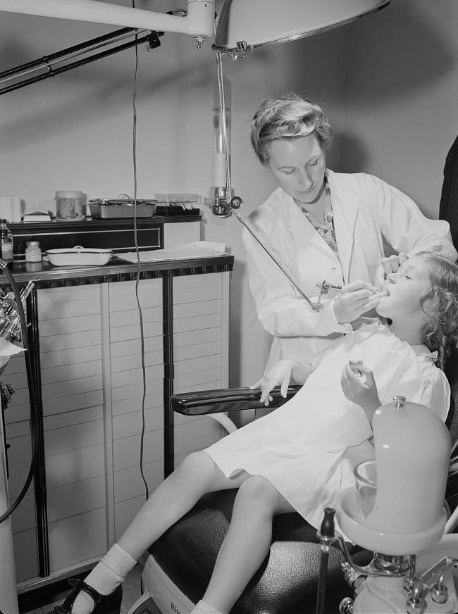 A little girl is having her teeth fixed in the Center's modern dental clinic, 1942