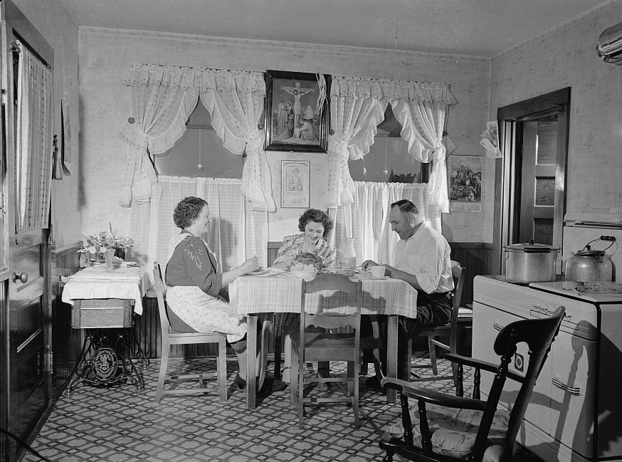 Ralph Eurlbut and his family at mealtime, 1942