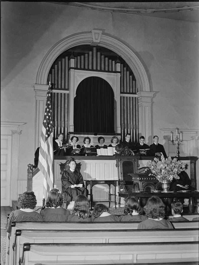 An American town and its way of life. The vested choir singing at a Sunday morning service, 1942