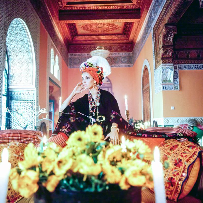 Talitha Getty wearing a turban and kaftan in her living room in Marrakesh, Morocco, January 15, 1970