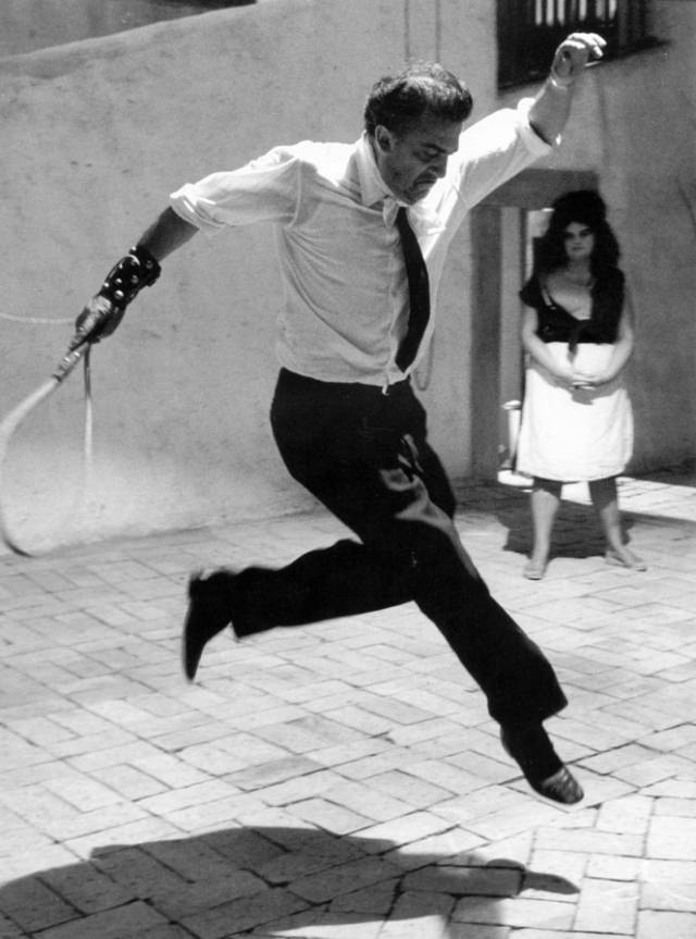 Fellini jumping on the set of 8 1/2, 1963