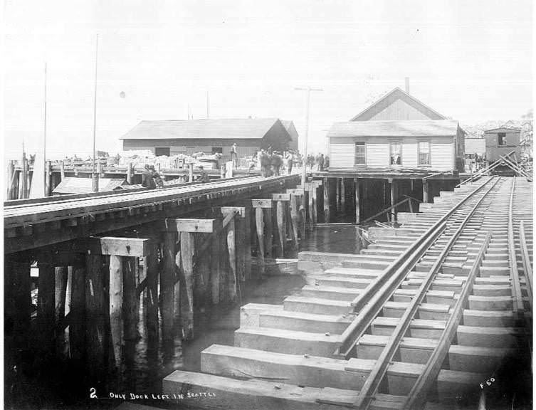 Goods piled on the Oregon Improvement Co. dock, 1889