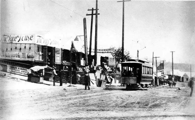 Temporary businesses and trolley car, 1889