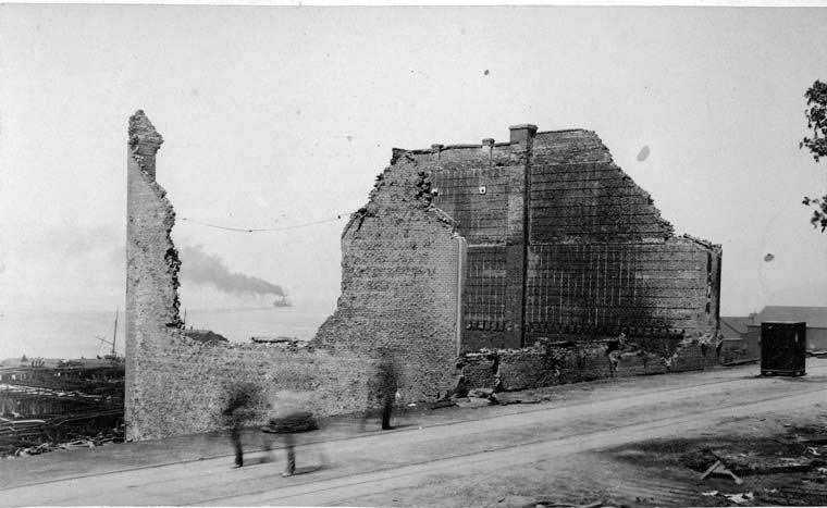 The ruins of the Northwest Cracker Factory and a safe on the street, 1889