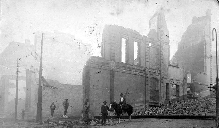 Ruins of Frye's Opera House at Northeast corner 1st Ave. and Marion St, 1889