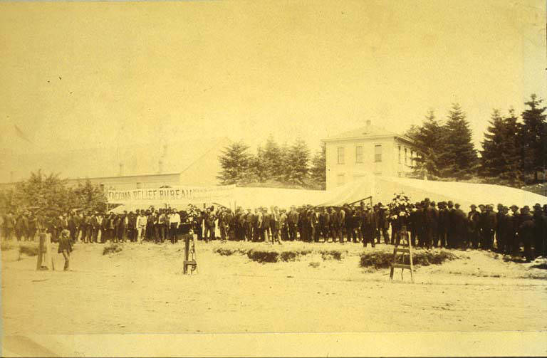 Bread line leading to tent of Tacoma Relief Bureau in vicinity of 3rd Ave. near Union St., Seattle, Washington, 1889