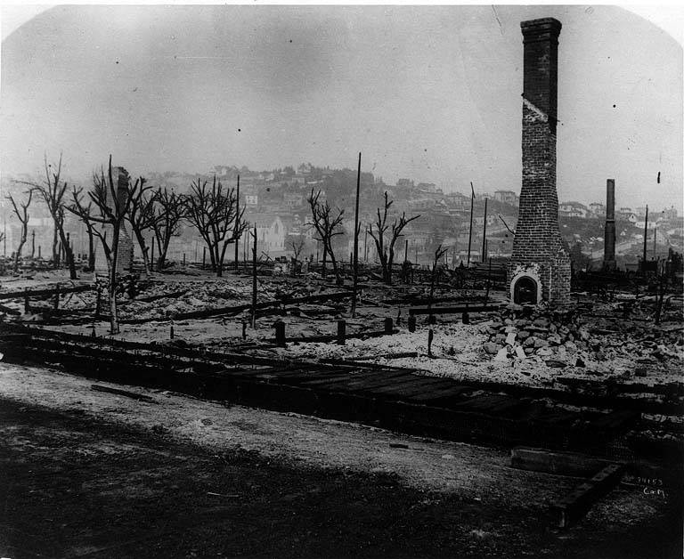 Looking north from S. King St., remains of buildings with chimney standing at right, 1889