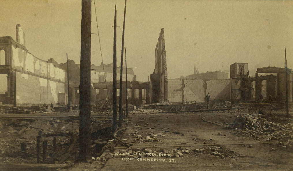 Looking north on 1st Avenue S. at Yesler toward the ruins of the Yesler-Leary Building, Seattle, Washington, 1889