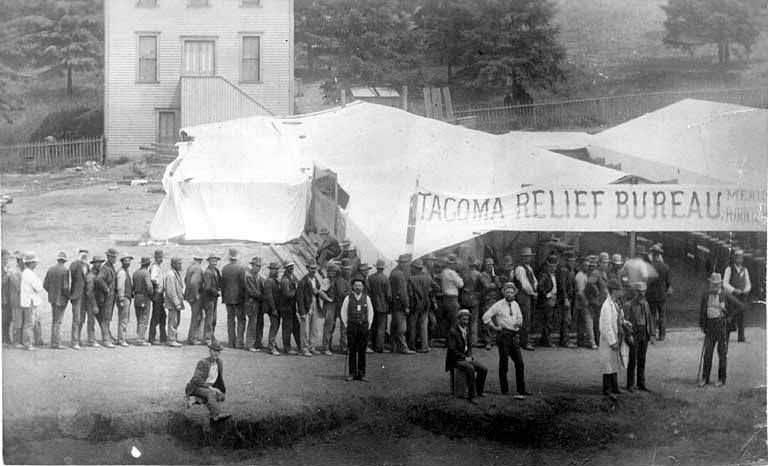 Large line of people in front of the Tacoma Relief Bureau tent near Third Ave. Union St, 1889