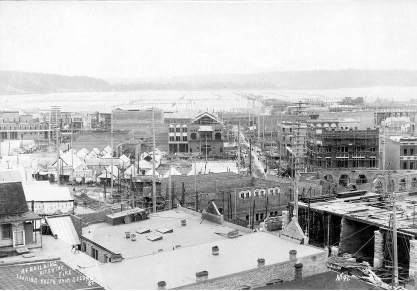 Looking south showing tents along Yesler Way and construction of the Standard Theatre and other buildings, 1889