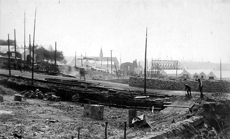 New building construction at center right after the Fire, 1889