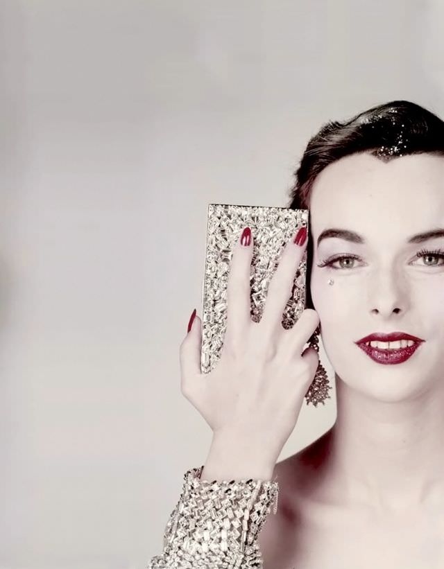 Victoria von Hagen with minaudière by Evans, bracelet from Henri Bendel, earrings by Ledo, Vogue US, October 15, 1952