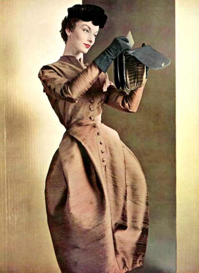 Victoria von Hagen in afternoon dress of bronze silk by Jean Dessès, crocodile bag by Ferest, L'Officiel, 1953