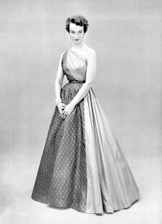 Victoria von Hagen in one-shoulder evening gown of rose taffeta and gray lightweight wool by Grès, 1953