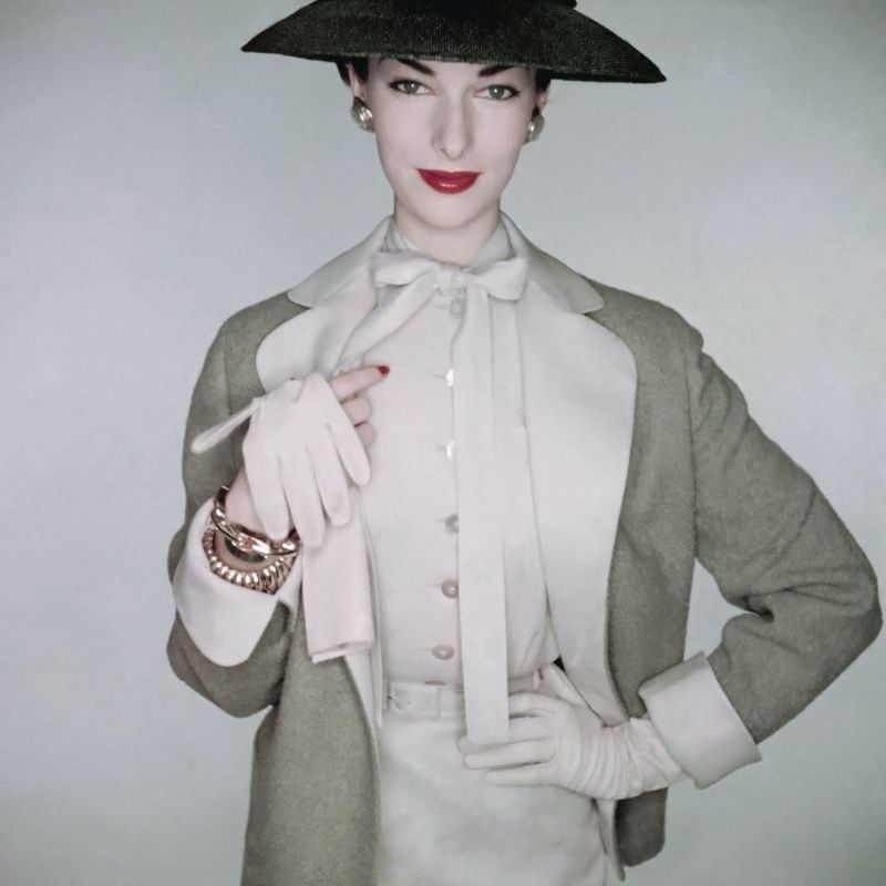 Victoria Von Hagen wearing linen blouse and skirt with pigskin gloves by Superb, 1953