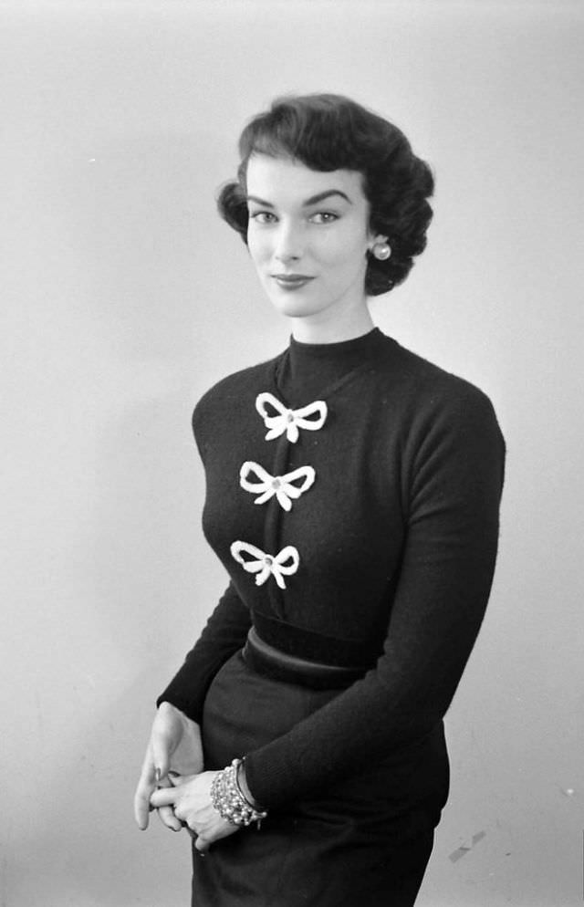 Victoria von Hagen in sweater adorned with bows, September 1952