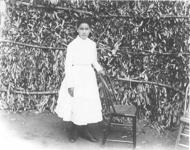 A daughter of Jimmie Rosemyre posing. Photo taken on Ranch El Tejon, 1880s