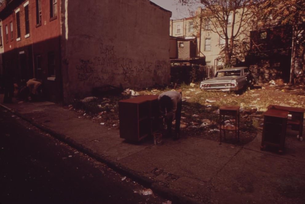Abandoned Car In Trash-Strewn Lot, August 1973