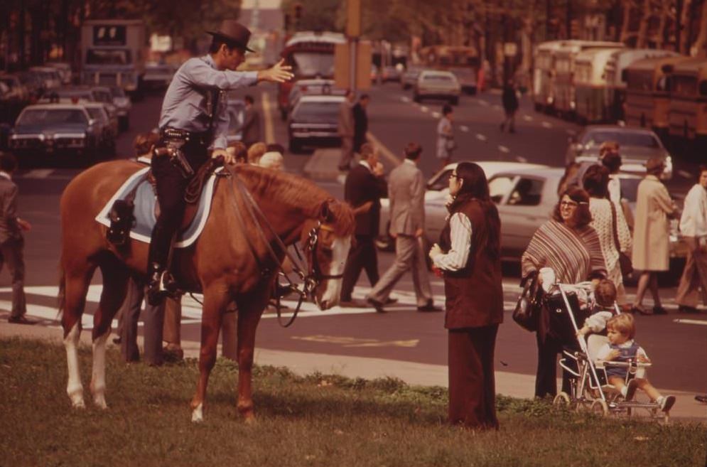 Mounted Policeman On Busy Downtown Thoroughfare, August 1973