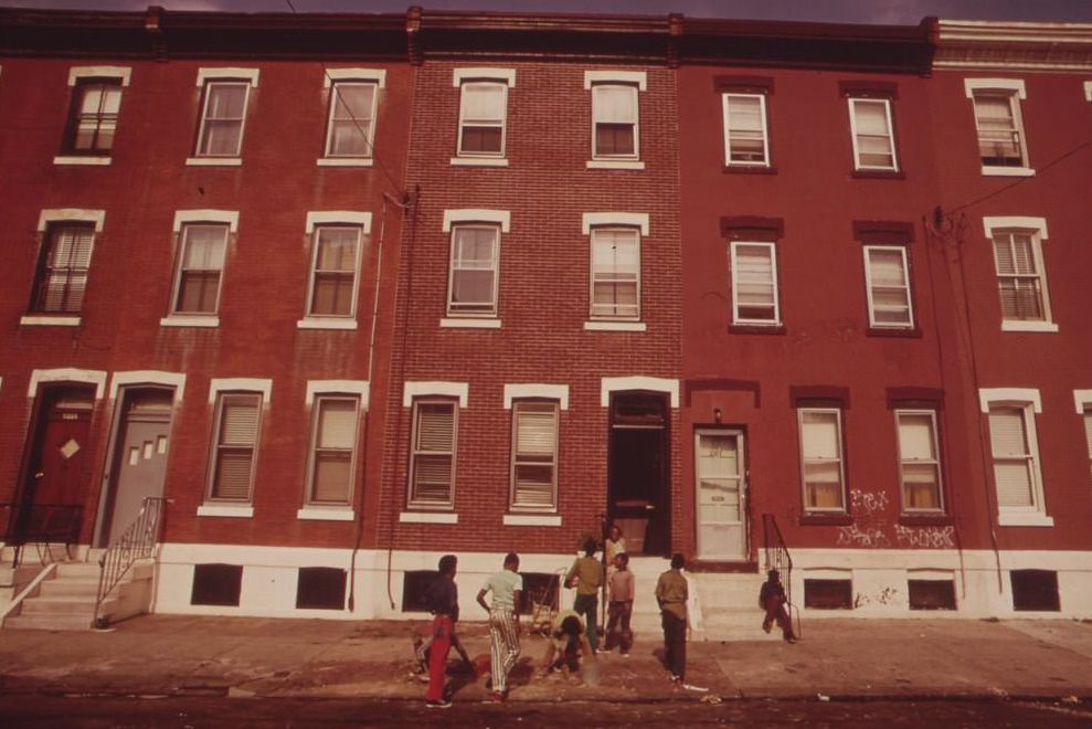 Neighborhood Youths Repaving Sidewalk In Front Of Apartment Buildings In North Philadelphia, August 1973