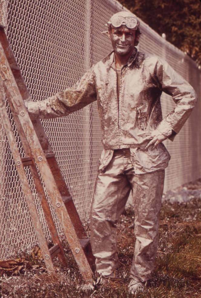 Painter Working On Chain Link Fence, August 1973