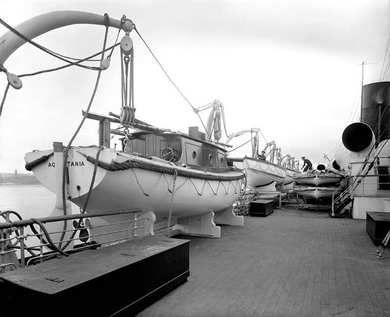 Aquitania's portside Boat Deck with steamship lines still reeling from the loss of life aboard Titanic, strolling space for passengers has been sacrificed for lifesaving equipment, 1914