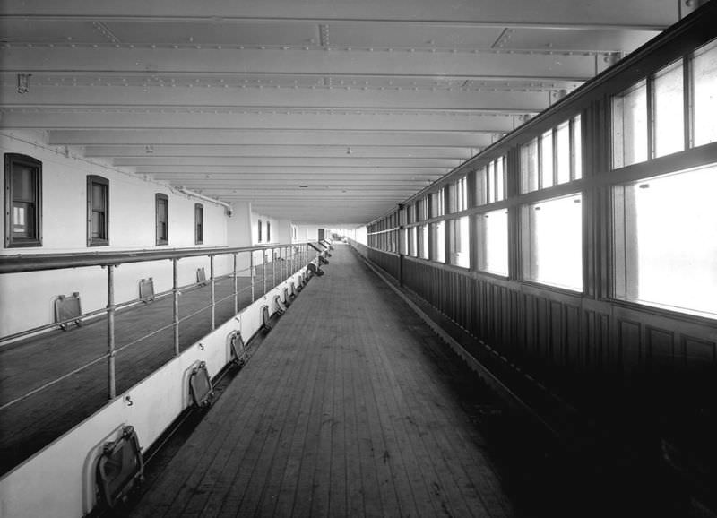 The sheltered part of Aquitania's 1st Class Promenade, on the port side of the Bridge Deck (B Deck).