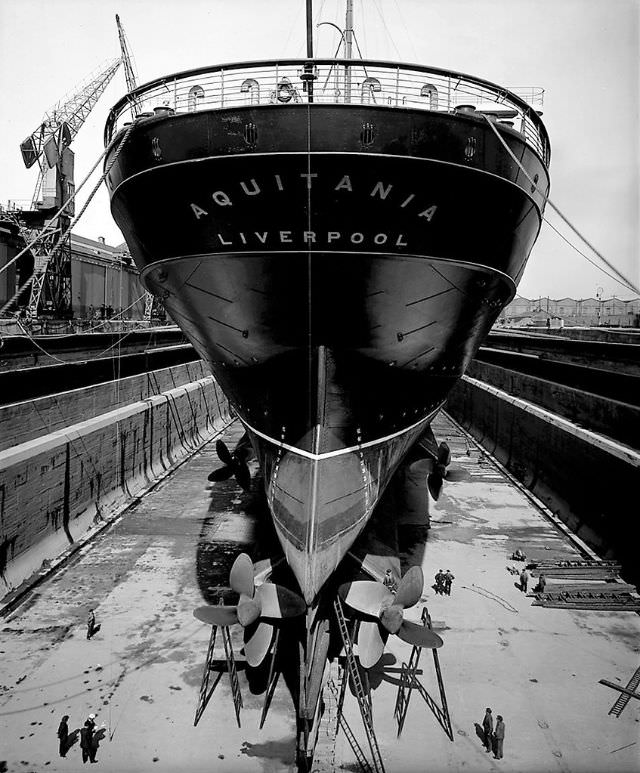 Aquitania in the Gladstone Graving Dock, Liverpool, in preparation for her maiden voyage. The cleaning and painting work appears to be complete, May 1914