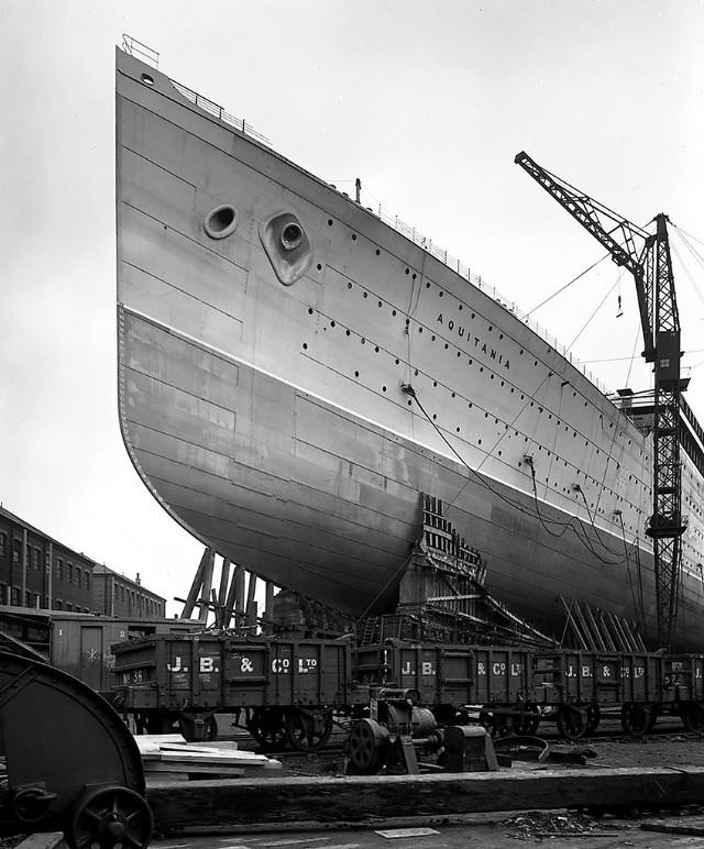 901 feet long, 97 feet wide. Passenger capacity- 610 1st Class, 950 2nd, and 1,998 3rd. The 45,647 ton Aquitania at John Brown & Company shortly before her launch, circa 1913