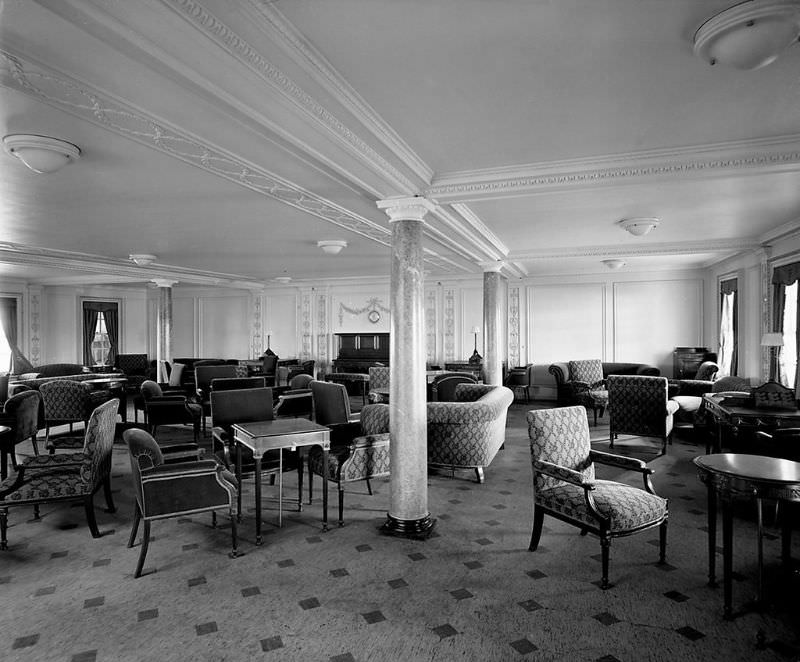 Aquitania's 2nd Class Lounge. The Louis XVI-style Second Class Lounge was on the Promenade Deck (D Deck). This is a view from the port side, looking towards the piano at the after end, May 1914