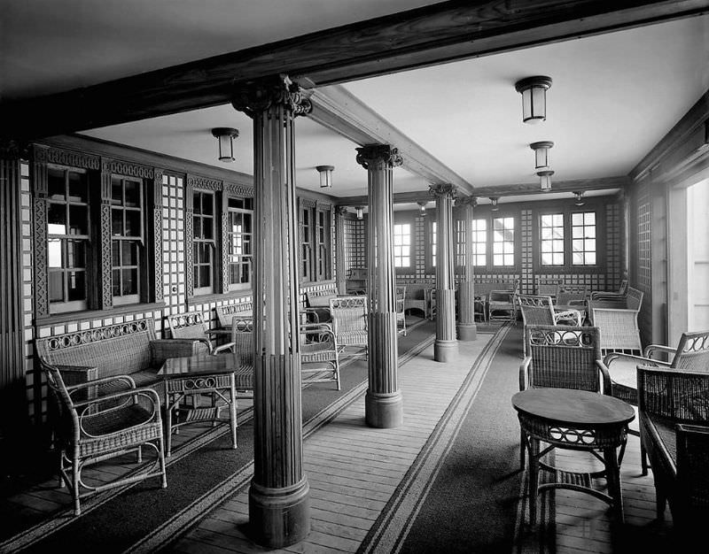 Aquitania's 2nd Class Verandah Cafe, on the Bridge Deck (B Deck). This view is looking across to the starboard side, with the sliding doors opened, May 1914