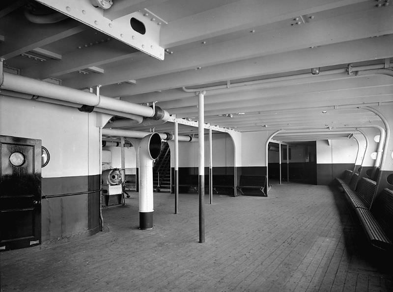 Deck view showing Aquitania's 3rd Class Promenade at the after end of the Upper Deck (D Deck), a view of the port side, looking aft. Sparred seats are fitted along the bulwark at the right edge of the image, May 1914