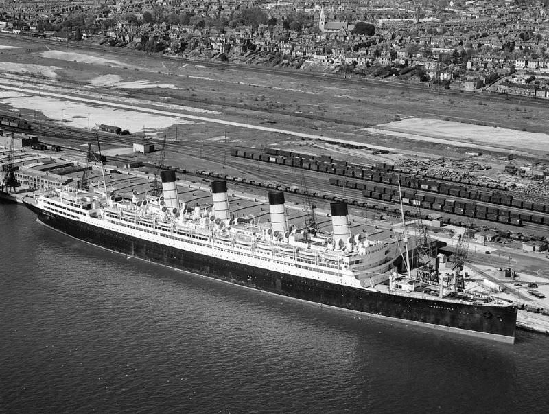 A final view of Aquitania, affectionately known throughout her long life as the 'Ship Beautiful'. She rests at Berth 107, Southampton Western Docks in September 1949