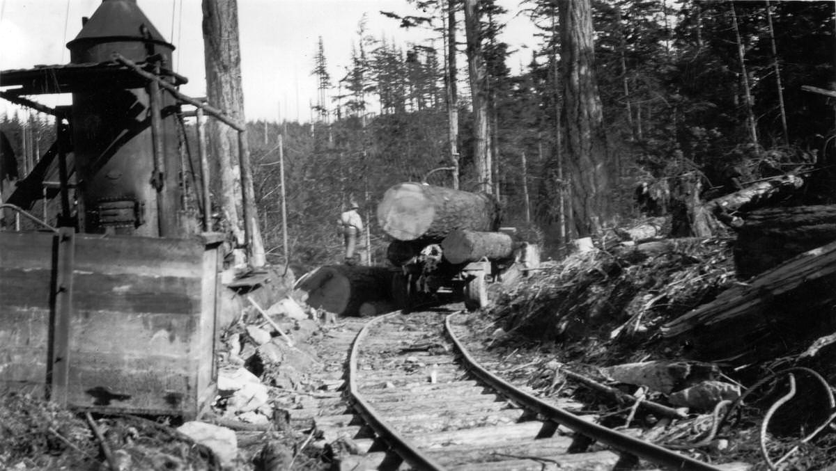 Mack Truck on Rails at The Landing Getting The Peak Log Loaded, 1926