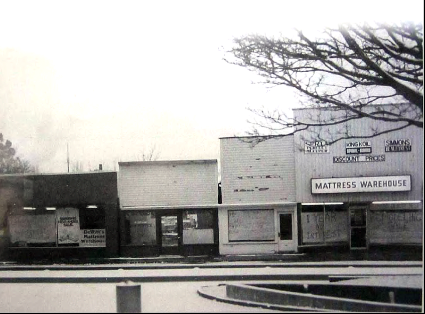 1970s view showing storefronts across from fountain in fountain district