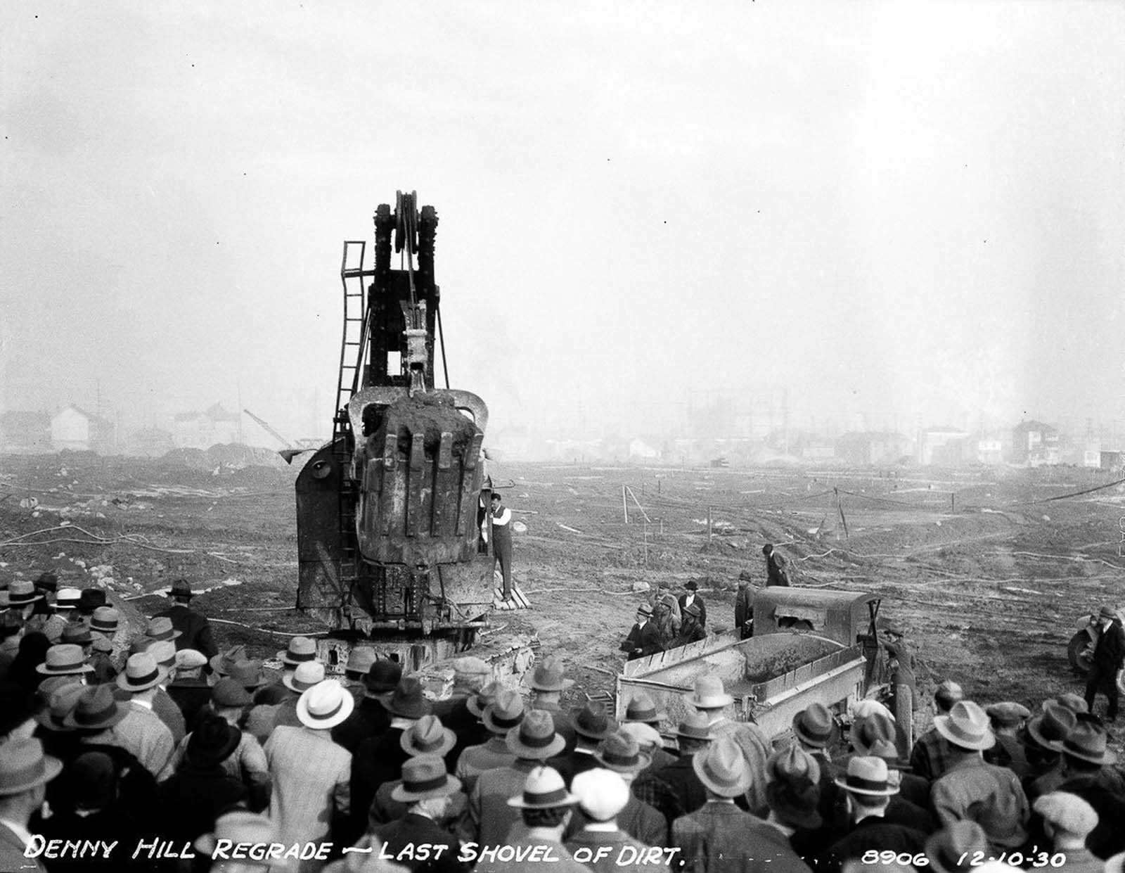 A crowd gathers to witness the last shovel of dirt and the completion of the second Denny regrade.