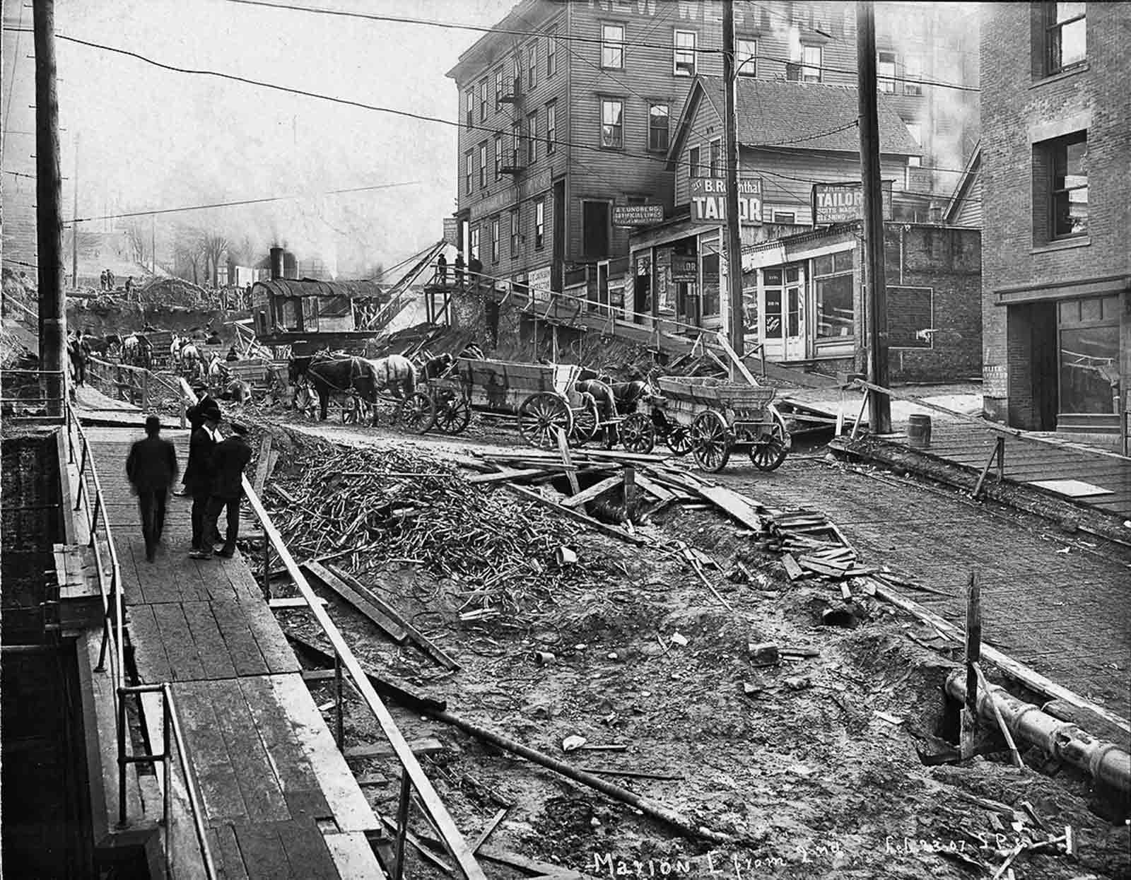 Horse teams march up Marion Street. 1907.